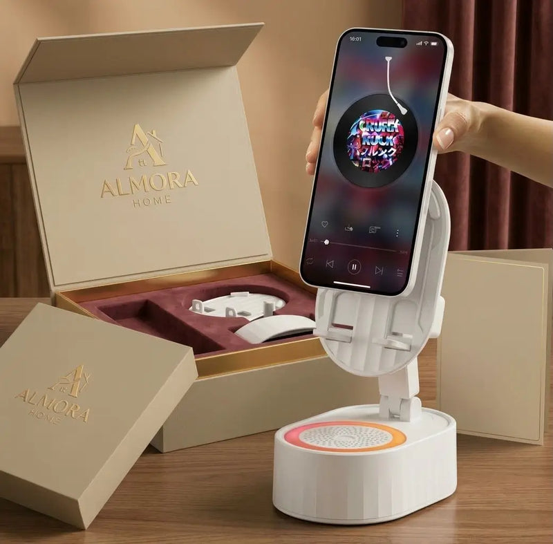 Caixa de som 5 em 1 branca com amplificação de áudio por indução, conectividade Bluetooth, suporte ajustável para celular e iluminação RGB colorida.